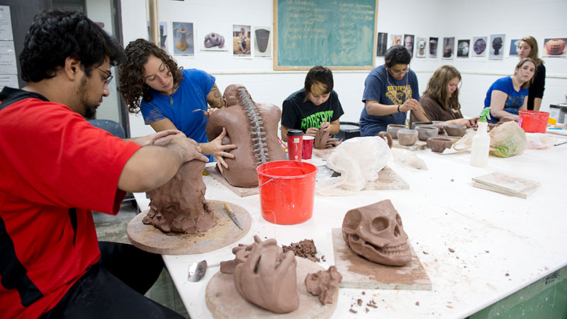students making clay sculptures