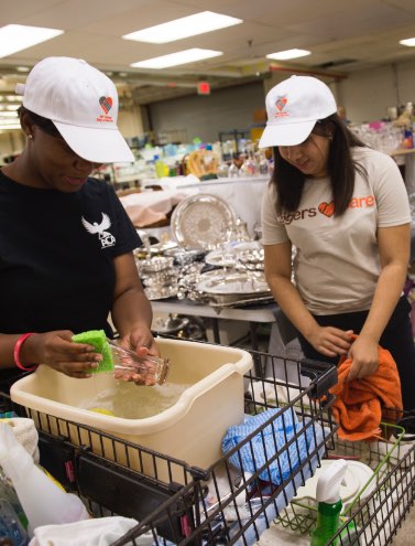 Students cleaning donated items