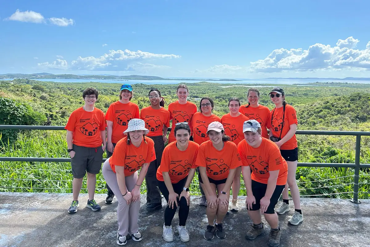 A group of R I T students posing for a photo during alternative break.