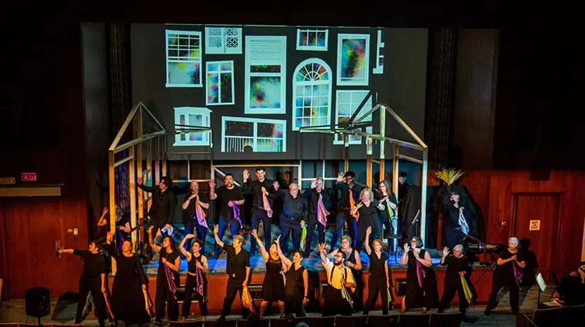 The cast of an experimental performance, The Hundred Windows, on stage at a theater.