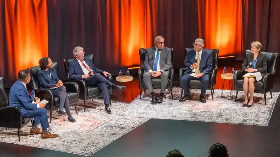 Six panelists sitting on stage during R I T in Conversation.