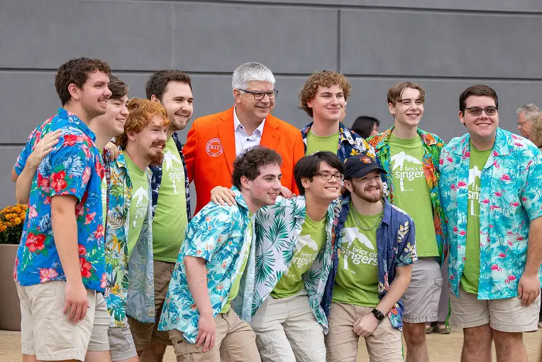 a group of students with RIT President Bill Sanders