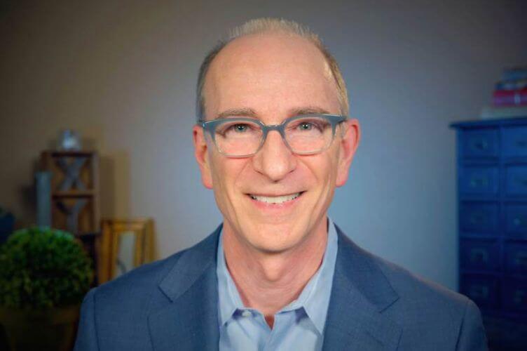 Tom Connor smiling into the camera.