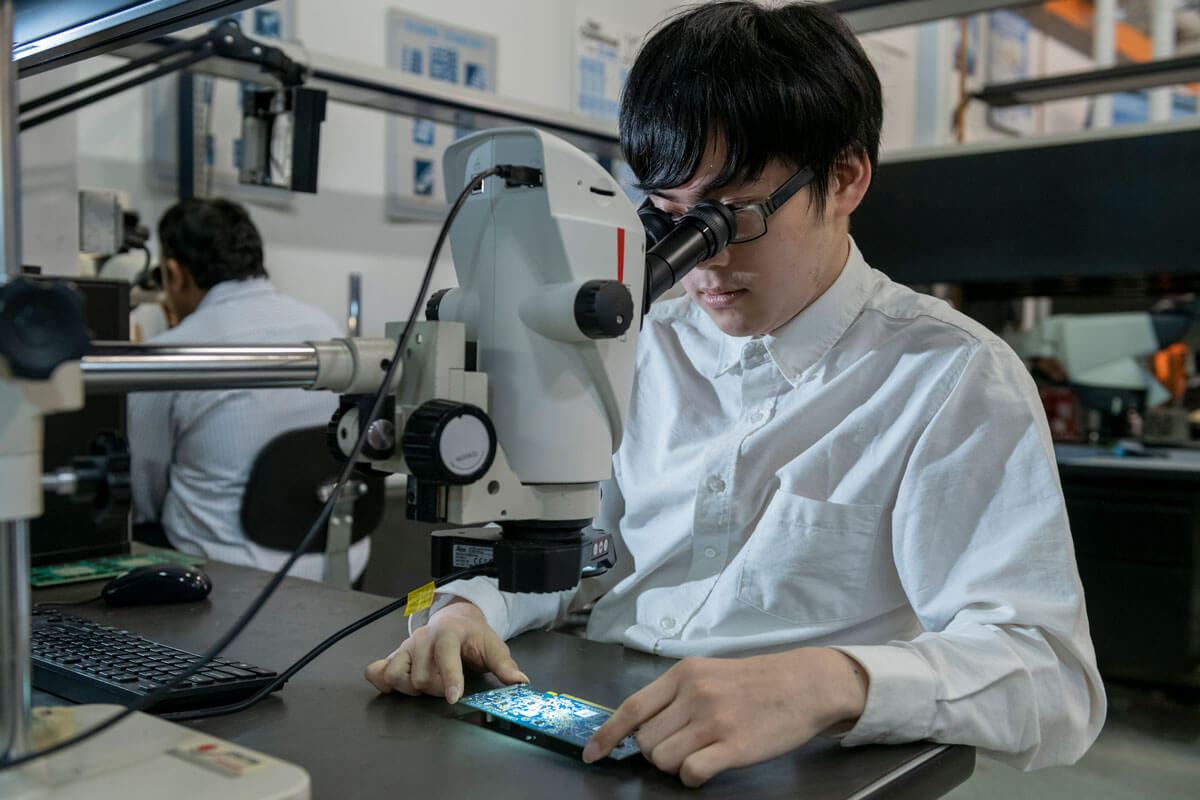 A lab worker in the Center for Electronics Manufacturing and Assembly.