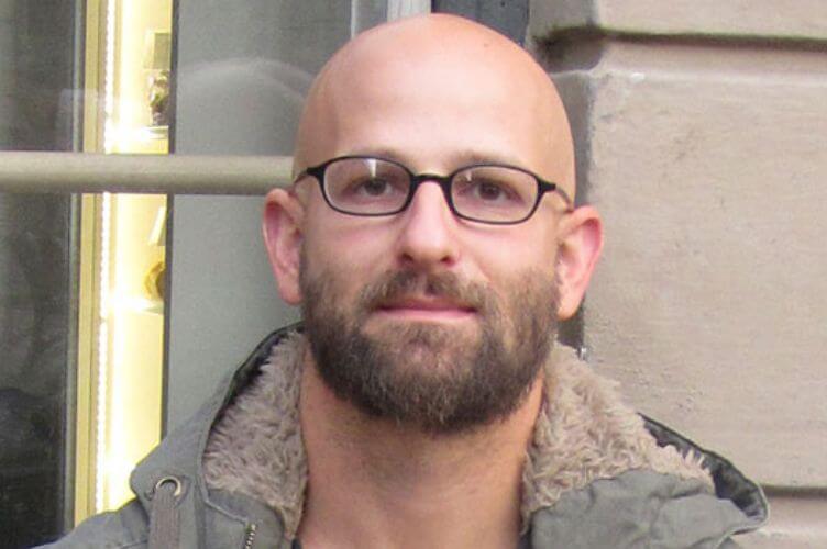 Gregory Halpern looking into the camera.