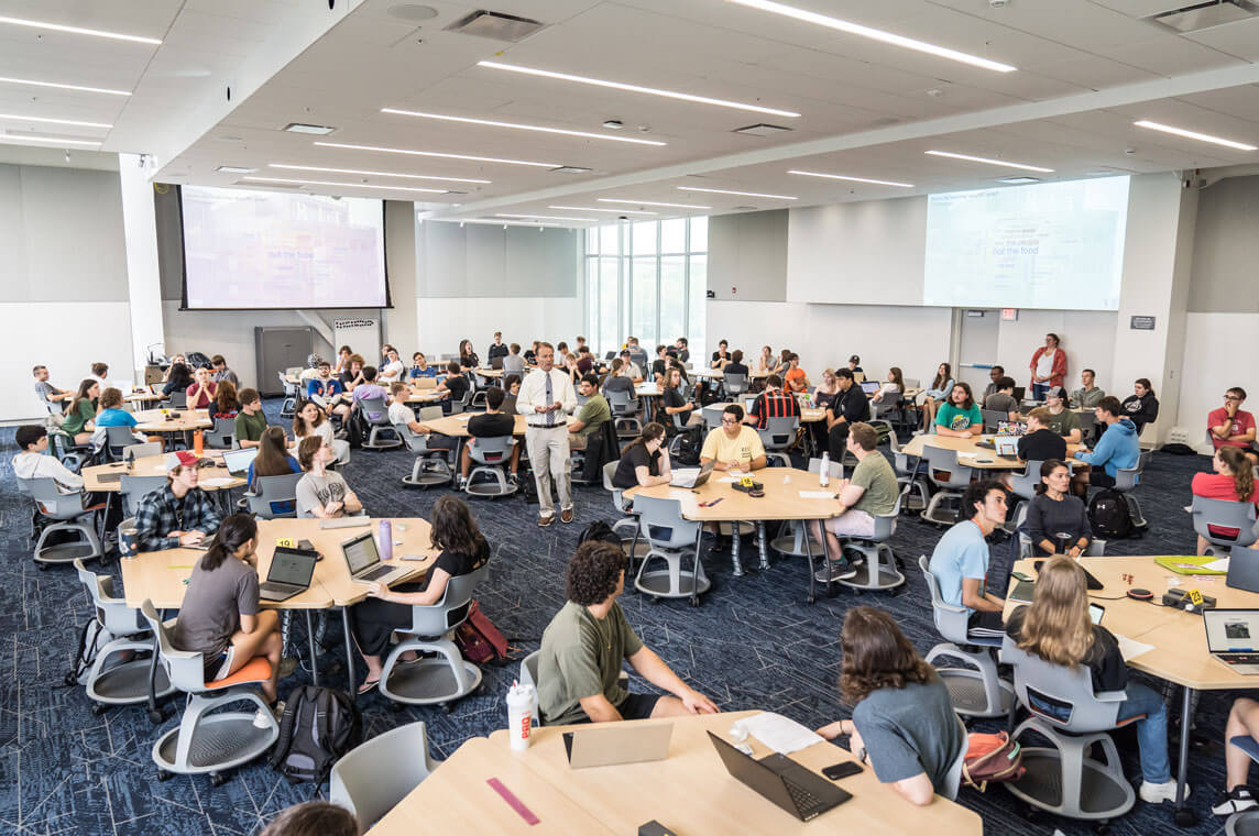 A class of R I T students sitting at desks in one of the new classrooms available in the SHED.