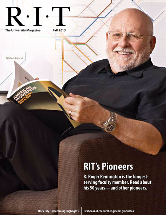 Professor sitting on chair reading a magazine