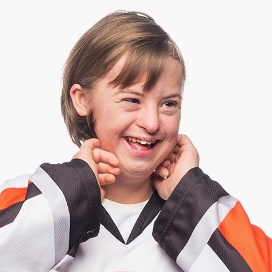 Girl smiling, wearing an RIT jersey.
