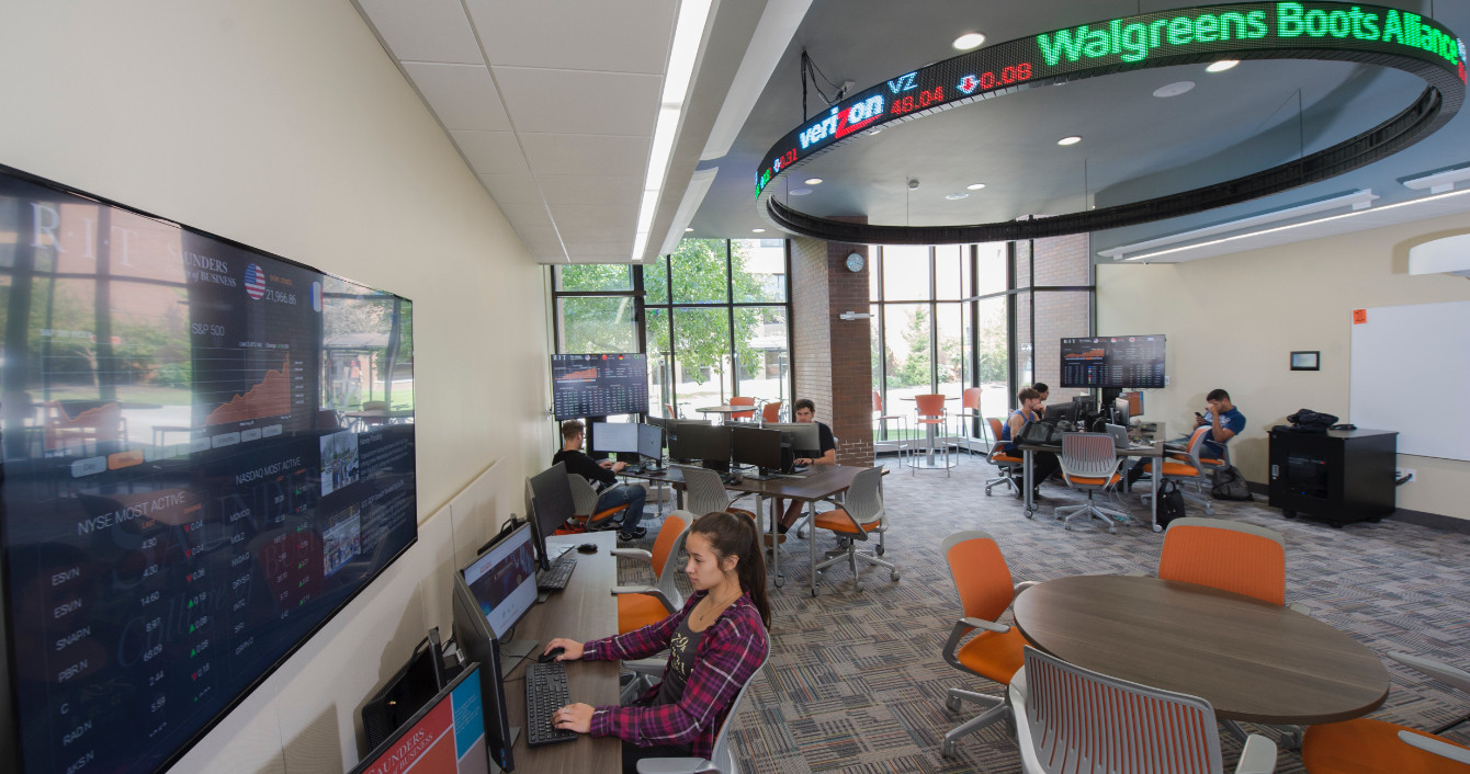 Computer lab with a stock ticker overhead