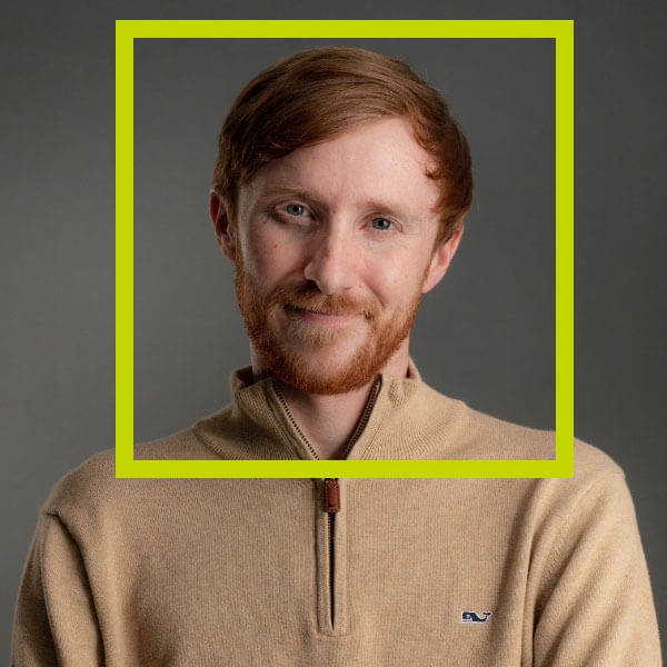 Headshot of Christopher Bruns with a green border around his face.