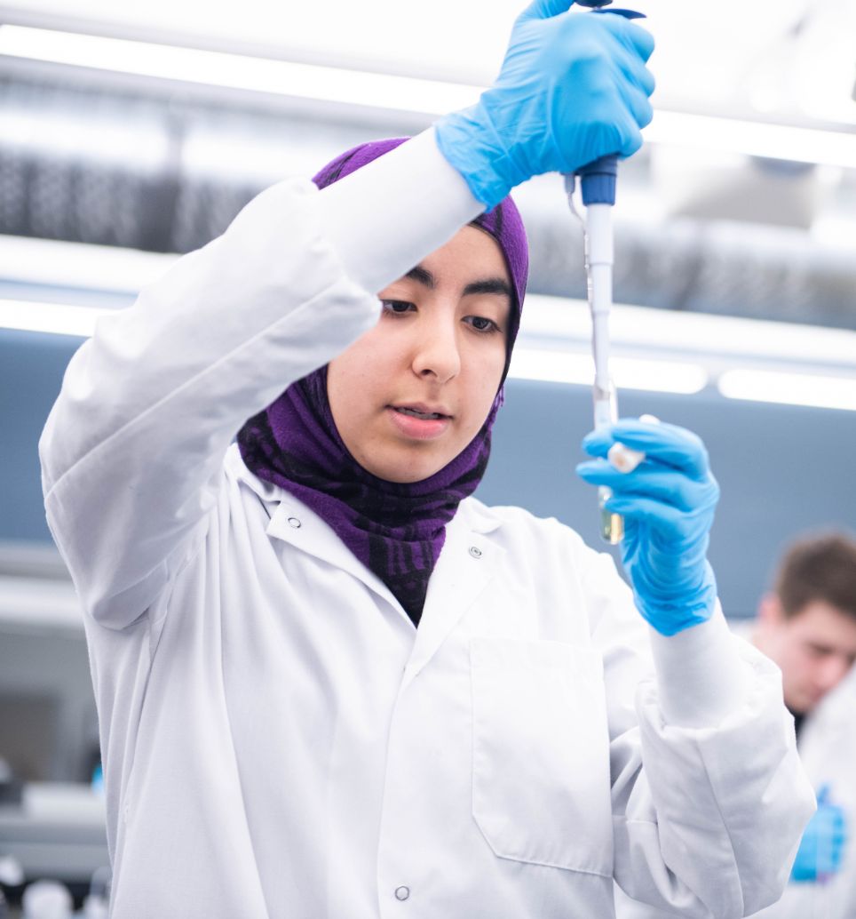 Student working with a pipette