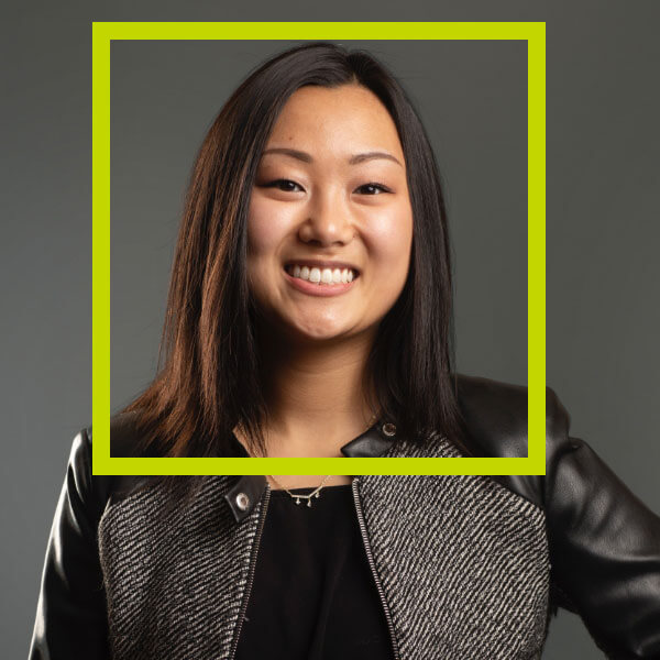 Headshot of Grace Yukawa with a green border around her face.