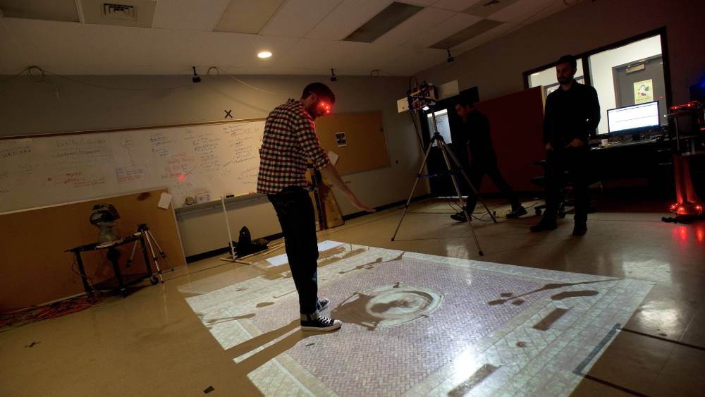 Man wearing augmented reality goggle and looking at the floor