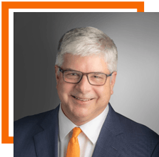 Portrait of Bill Sanders with an orange RIT border around it