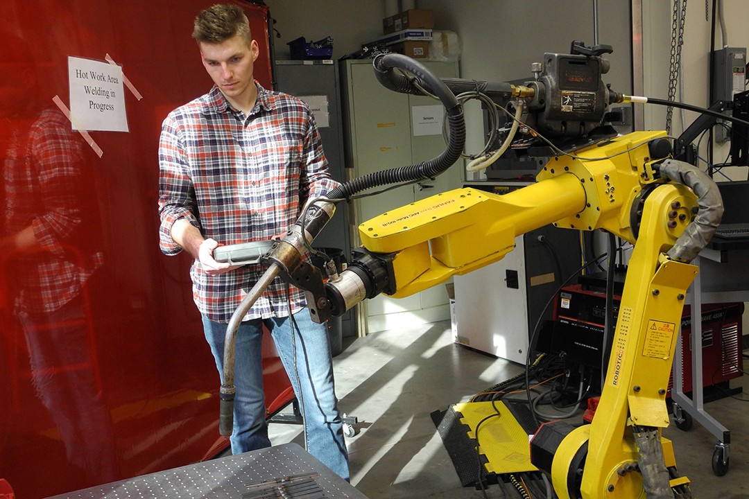 Engineering technology student upgrades industrial robot to be used for future classes