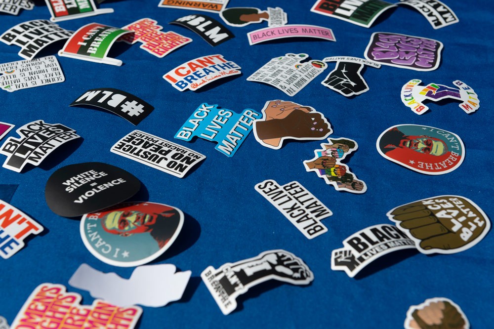BLM stickers spread out on table