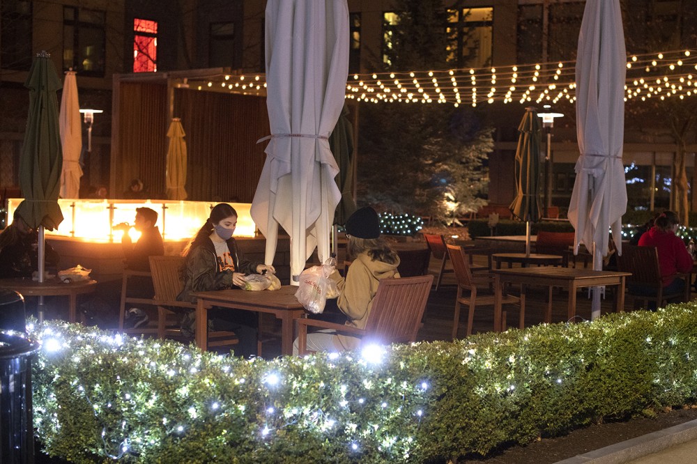 students in Global Village at night