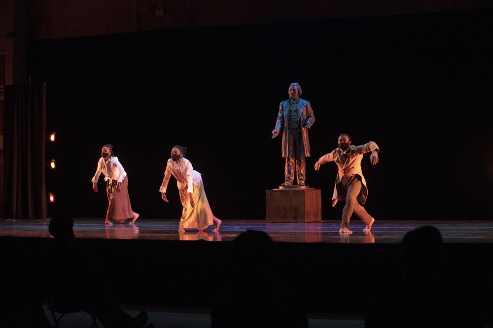 dancers performing on stage.