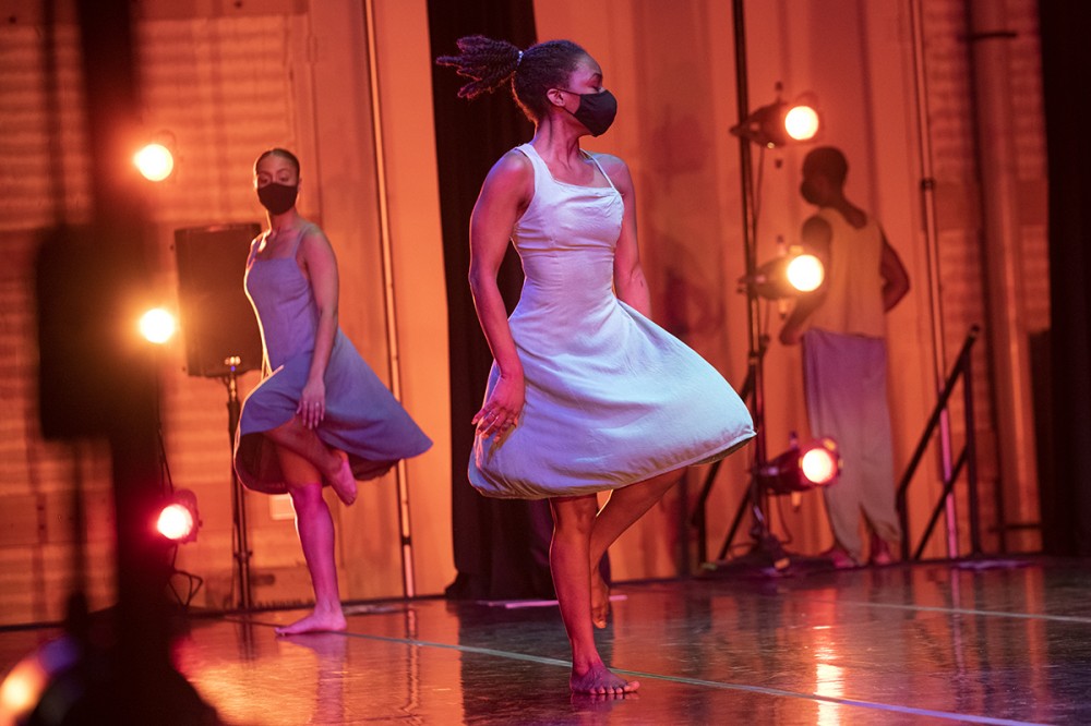 dancers performing on stage.