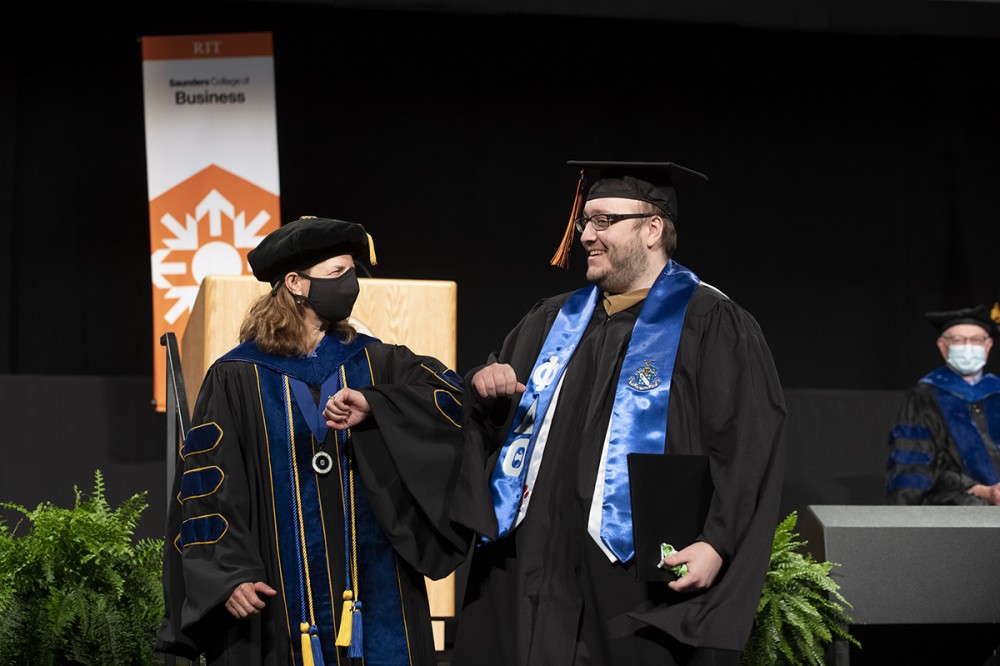 Dean and male graduate