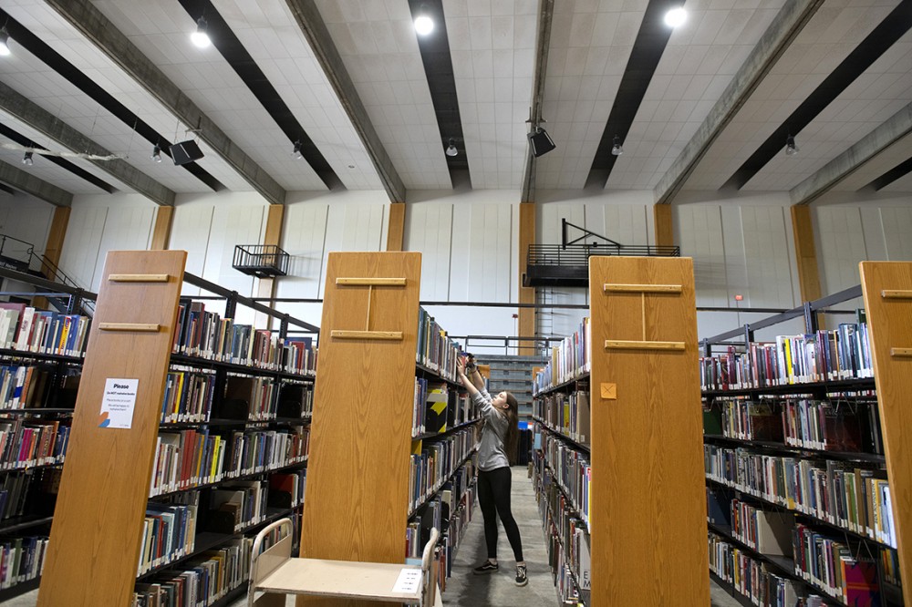 student scanning books