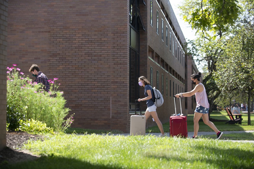 two women with suitcases
