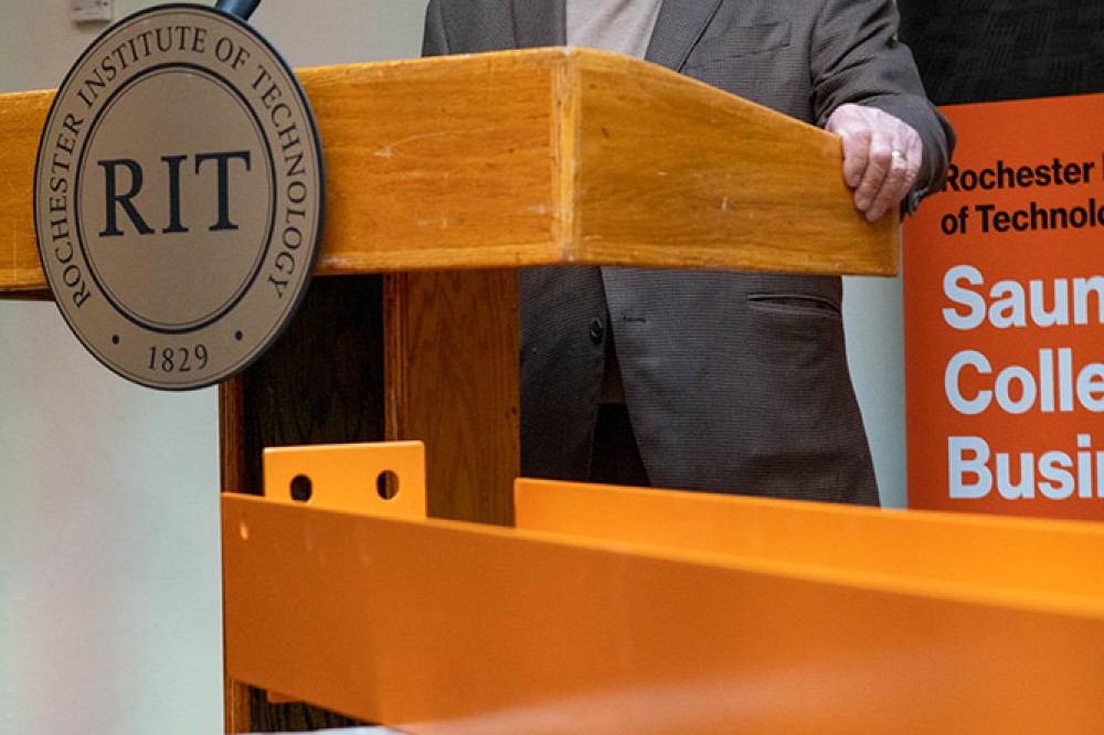 man speaking at a podium.