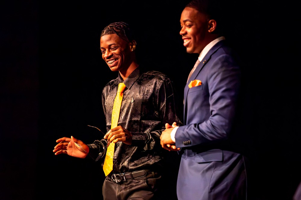 two college students smiling.