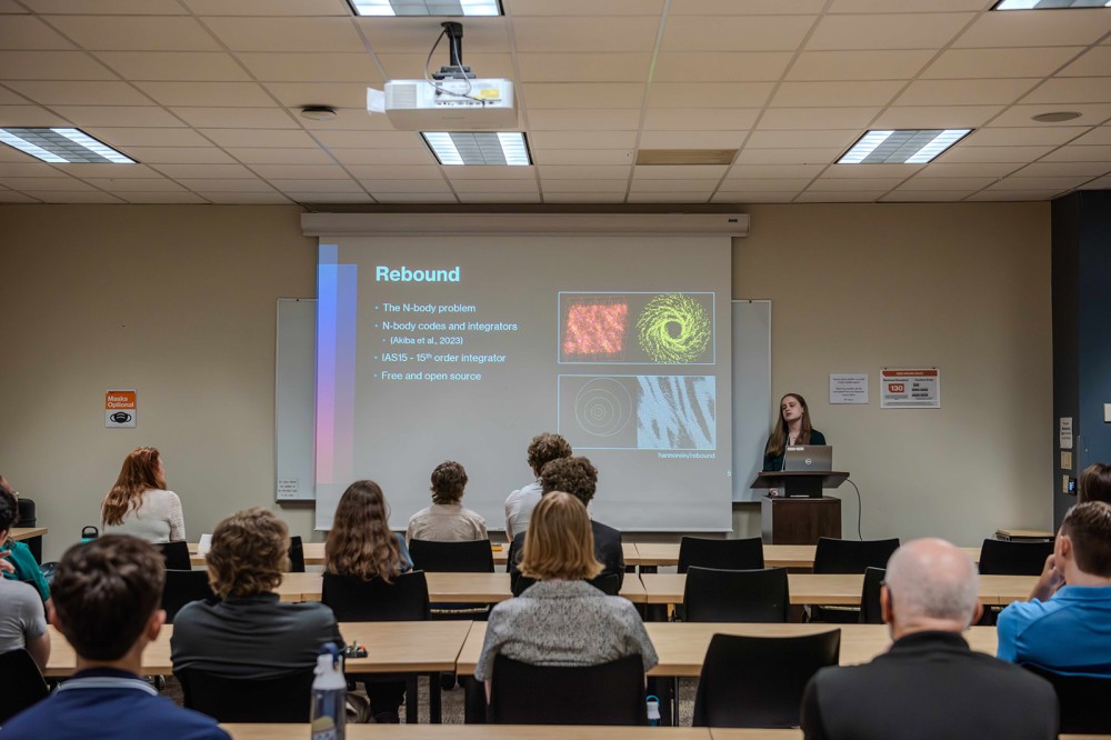 people are shown sitting at tables watching a presentation called rebound.