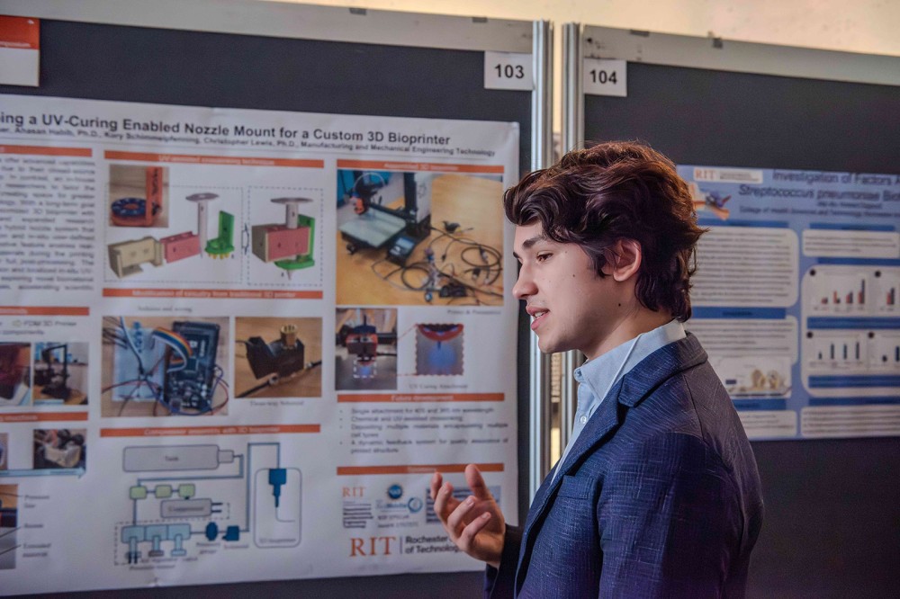 a student appears next to his presentation looking at the material.