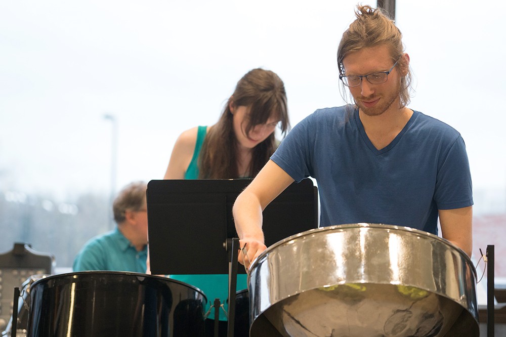 <p>Stephen Ferm, a fifth-year electrical engineering technology major from New Jersey, plays drums at the debut performance of the RIT Steelband Ensemble in the Fireside Lounge.</p>
