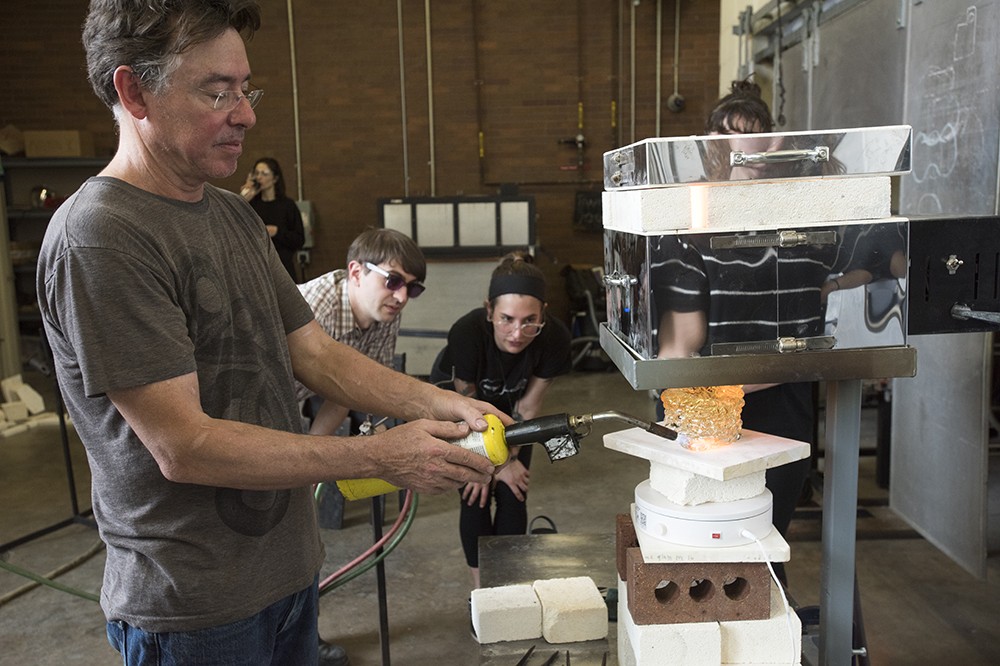 <p>Peter Houk, director of the Massachusetts Institute of Technology (MIT) Glass Lab, demonstrates 3D&nbsp;glass printing in the glass shop. Houk was here for a two-day lecture/demo visit with MIT researchers Daniel Lizardo and Michael Stern to present the integration of art, design, engineering and technology.</p>
