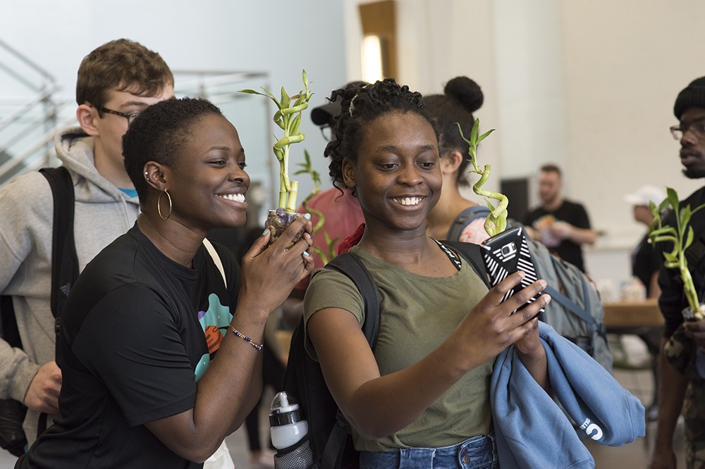 <p>From left, second-year students Destiny Cowans (advertising and public relations) and Gloria Berakah (marketing) take a selfie with the space plant terrariums they created at Space Camp, one of the many activities during&nbsp;SpringFest. SpringFest took place April 11-14.</p>
