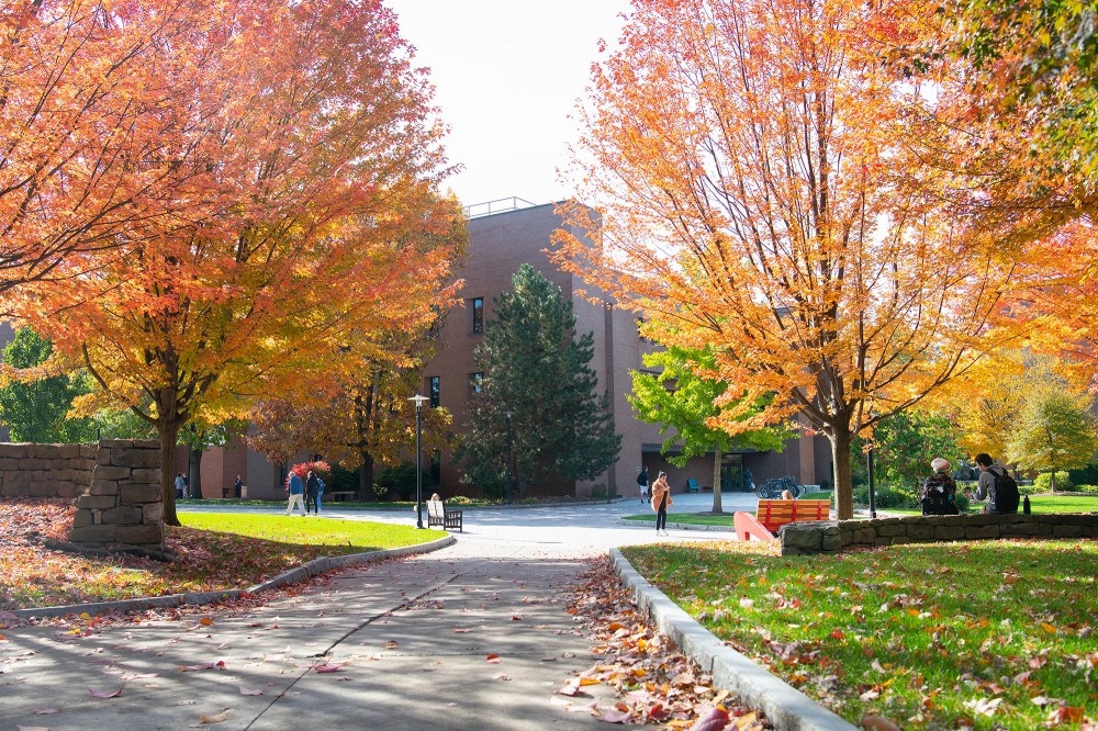 <p>Students in Eastman Kodak Quad enjoy a sunny day.&nbsp;Fall color is in full swing on campus.</p>
