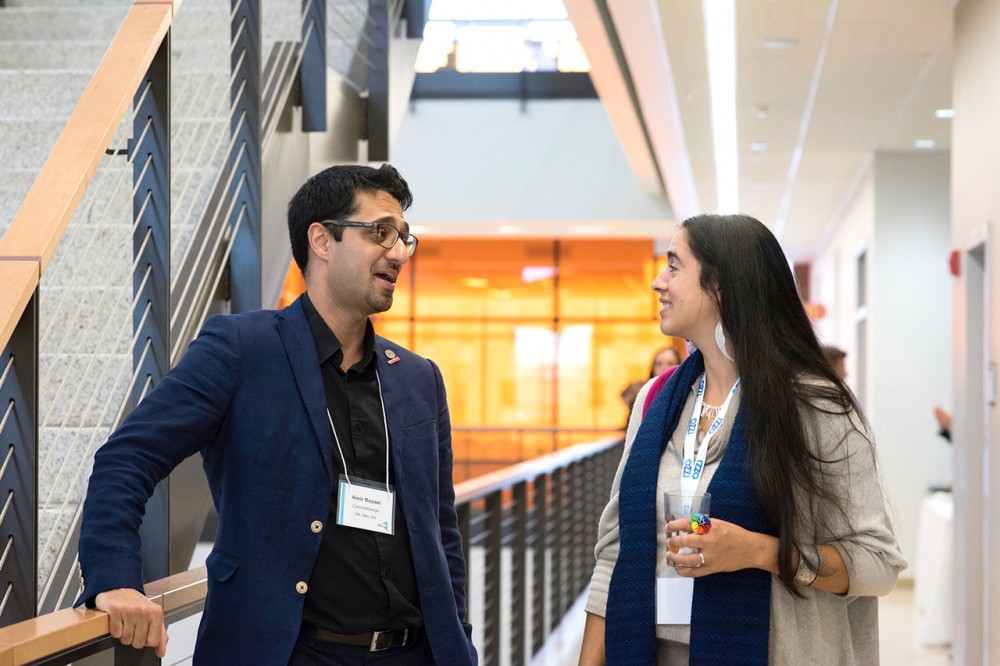 man and woman talking on stairs