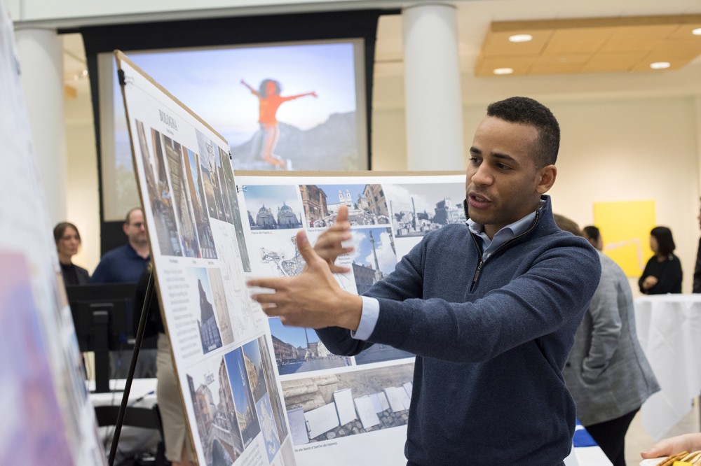 student talking with his display to the side
