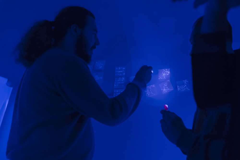 student drawing on board