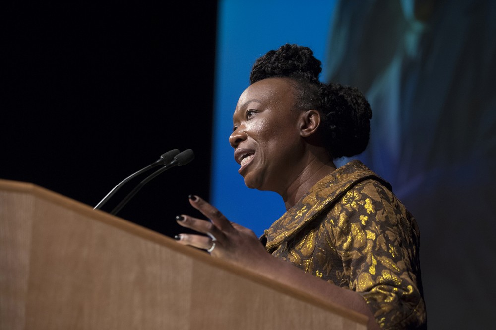woman speaking at podium