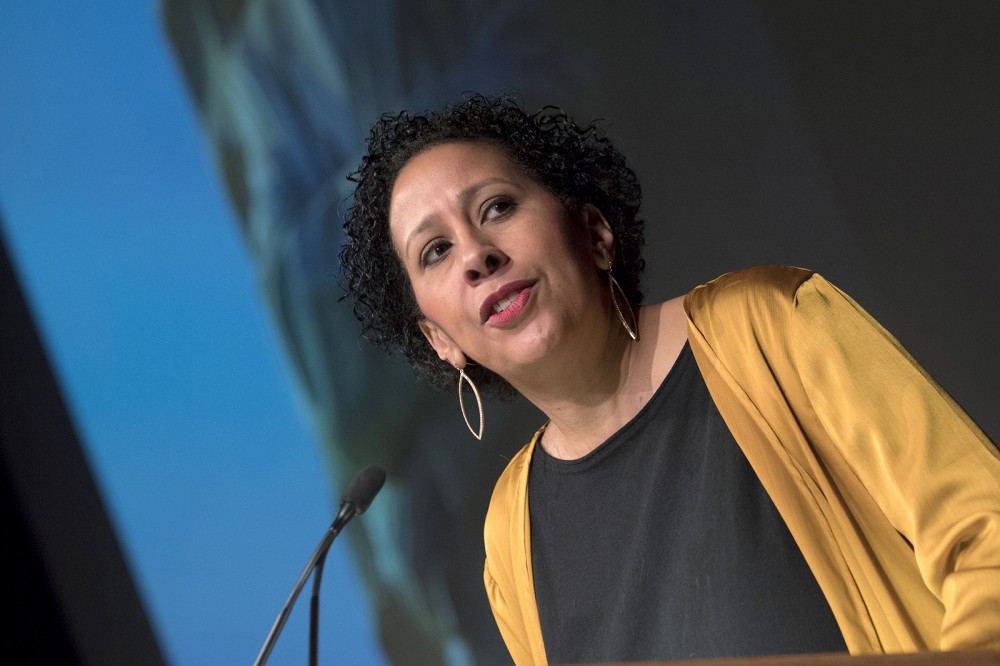 woman speaking at podium