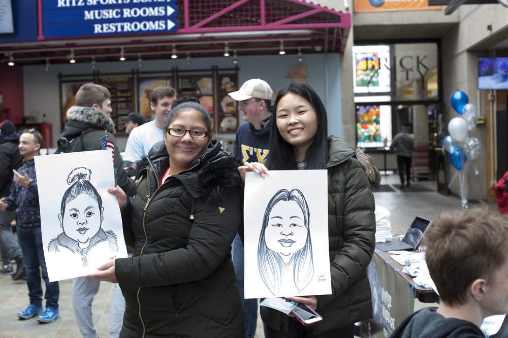 two female students with caricatures