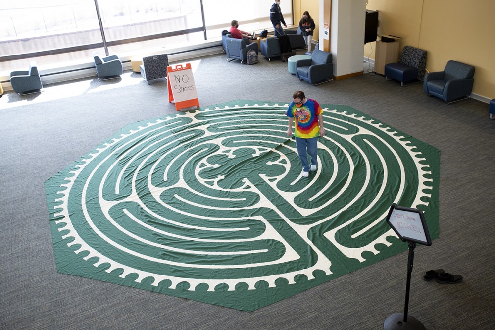 student walking a labyrinth.