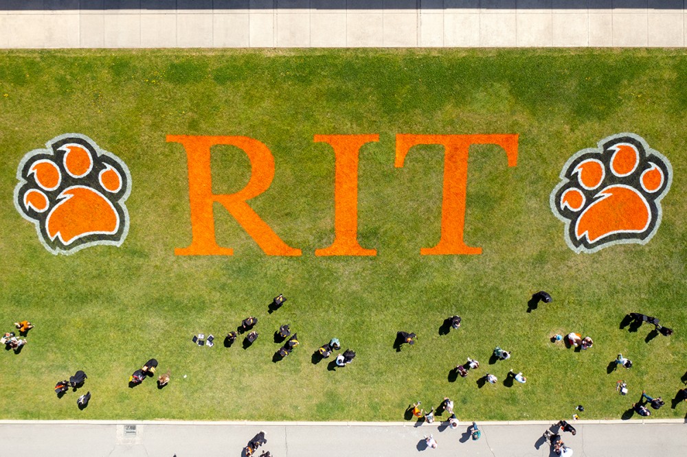 drone shot of logo on grass