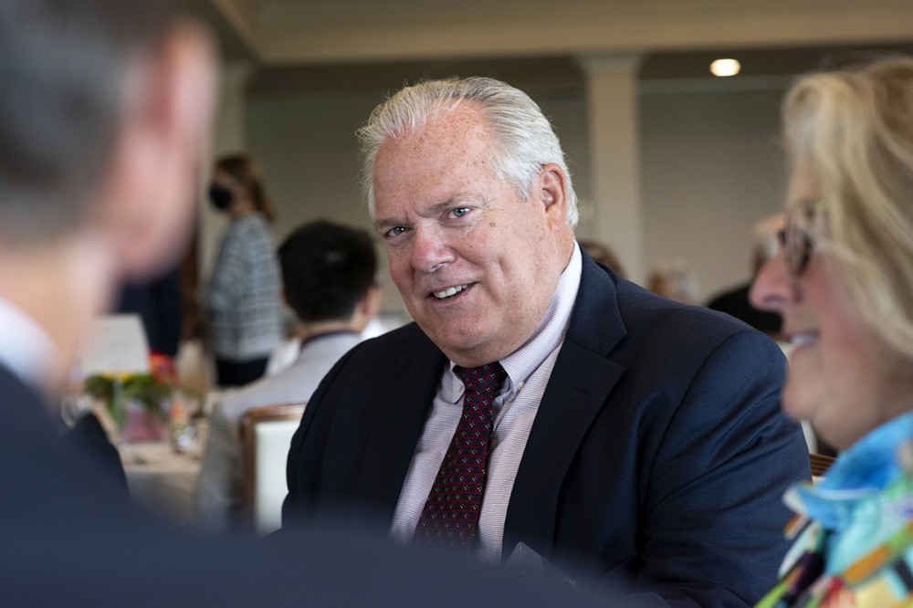 man at table smiling