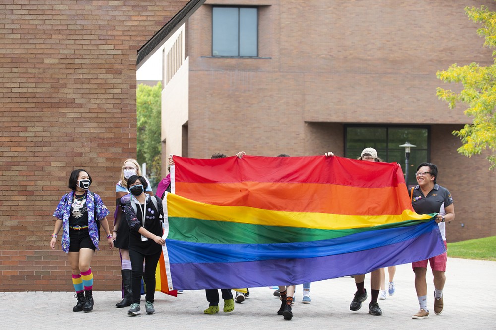 students with Pride flag