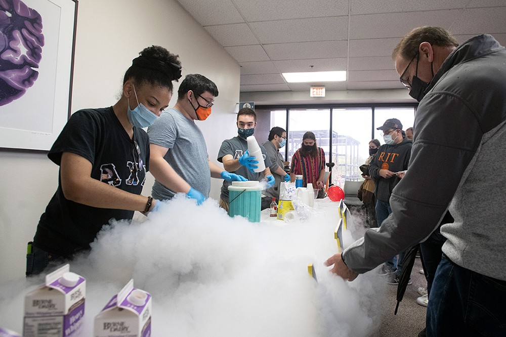 <p>Victoria Adams, a fourth-year packaging science student, and Sean Su, a fifth-year chemical engineering student, create nitrogen ice cream at a Science Fair during Brick City Homecoming and Family Weekend. Other events from the weekend included a comedian, men's and women's hockey games, musical performances, student film screenings, guest speakers, and open houses and tours.</p>
