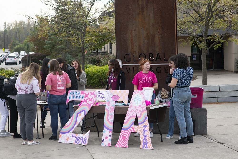 <p>Zeta Tau Alpha’s Pinktober fundraiser for breast cancer education and awareness is all October long. Here, they are set up at Global Village.</p>
