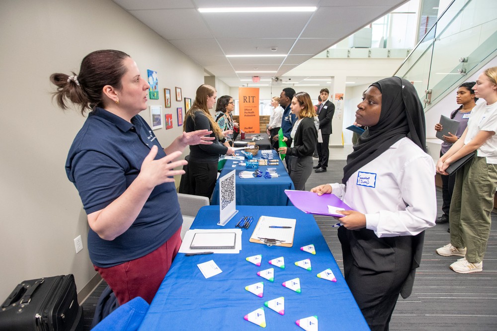 Sway Issifou is shown speaking to a potential employer at the CHST Career Fair in March.