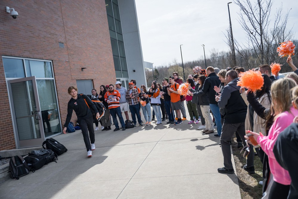 Matthew Wilde is greeted by cheering fans as he leaves the Gene Polisseni Center locker room to board a bus to the airport