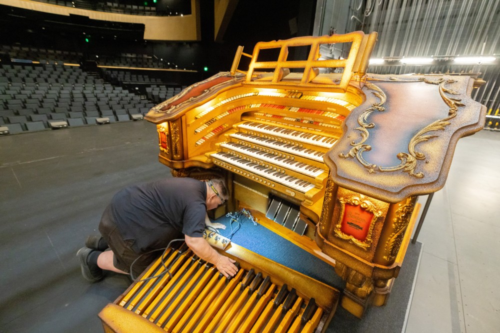 a large organ is on display inside a performing arts center
