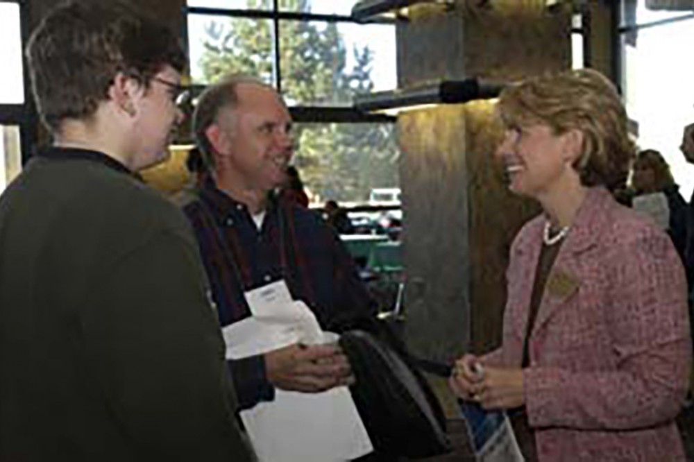 Mary-Beth Cooper, RIT's vice president of student affairs, greets parents and students at the Brick City Festival. Cooper hosted a breakfast on Oct. 23 to discuss the transition into college life for new students, as well as the variety of campus programs and services offered to them. Thousands of students, parents and alumni were among those to take part in this years Brick City celebration.